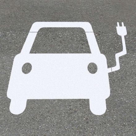 painted floor sign by an EV charging unit