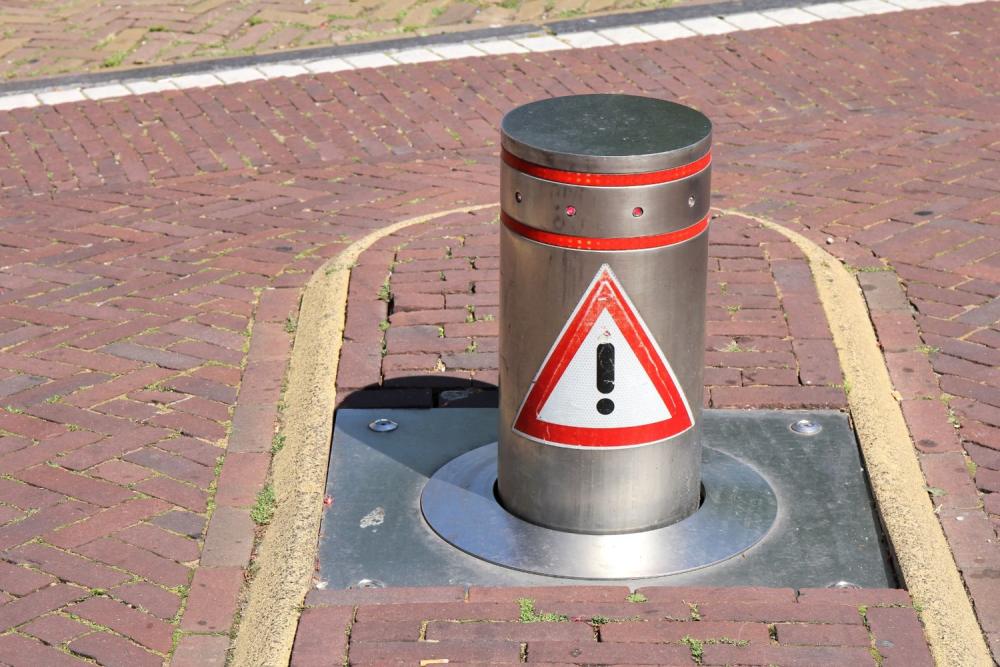 telescopic bollard half lowered on a drive