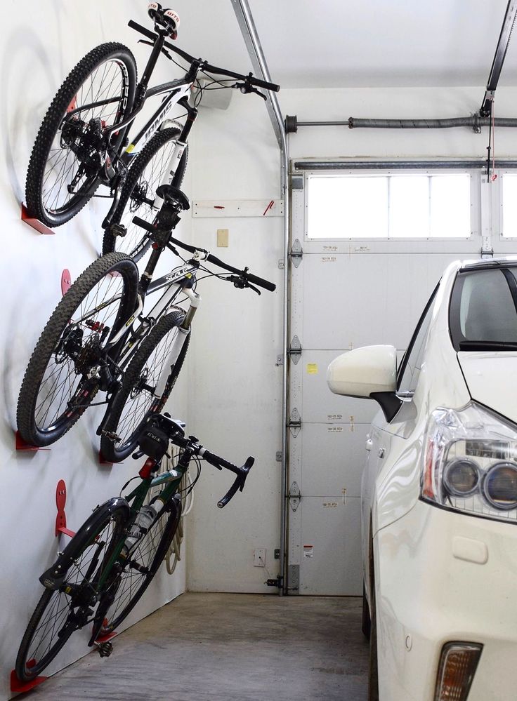 2 bikes on a garage wall