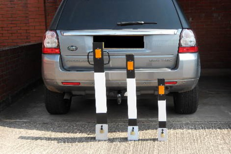 removeable bollards with a car