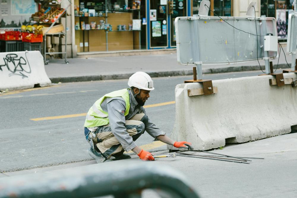 Barriers being fixed on a road