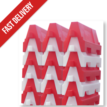 Road barriers stacked for transit